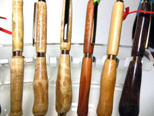 Pens shaped for left handed and right handed grips